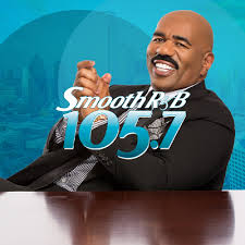 Radio host promoting Smooth R&B 105.7 with a cheerful expression